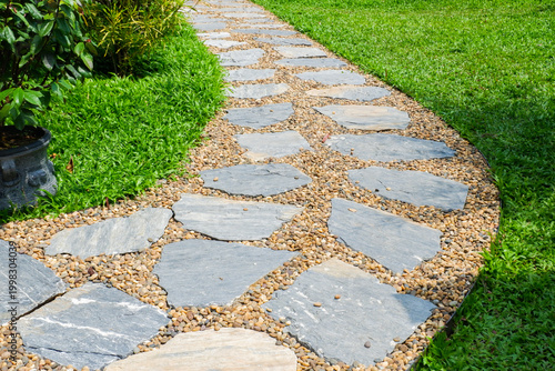 Foto Garden landscape design with pathway in garden and footpath in picturesque summer park and staircase in backyard,Paving stones on floor in park,space for text