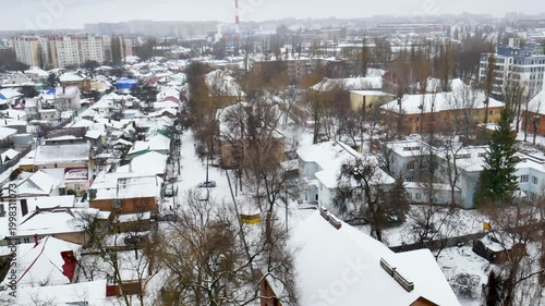 Voronezh, Russia, January 3, 2026: Winter residential area of ​​Voronezh with private sector and multi-story buildings, view from above