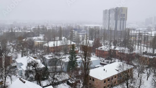 Voronezh, Russia, January 3, 2026: Winter residential area of ​​Voronezh with private sector and multi-story buildings, view from above