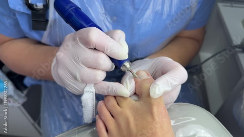Making  hardware pedicure. Foot and nails care concept