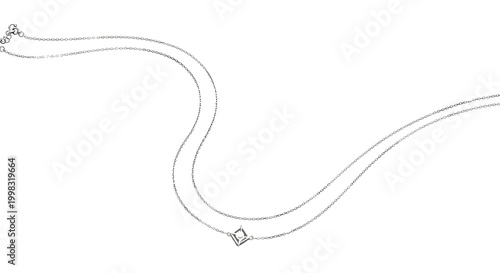 A layered silver necklace with a geometric frame and pearl pendant rests on a smooth marble surface to highlight fine jewelry design and luxurious aesthetic quality.
