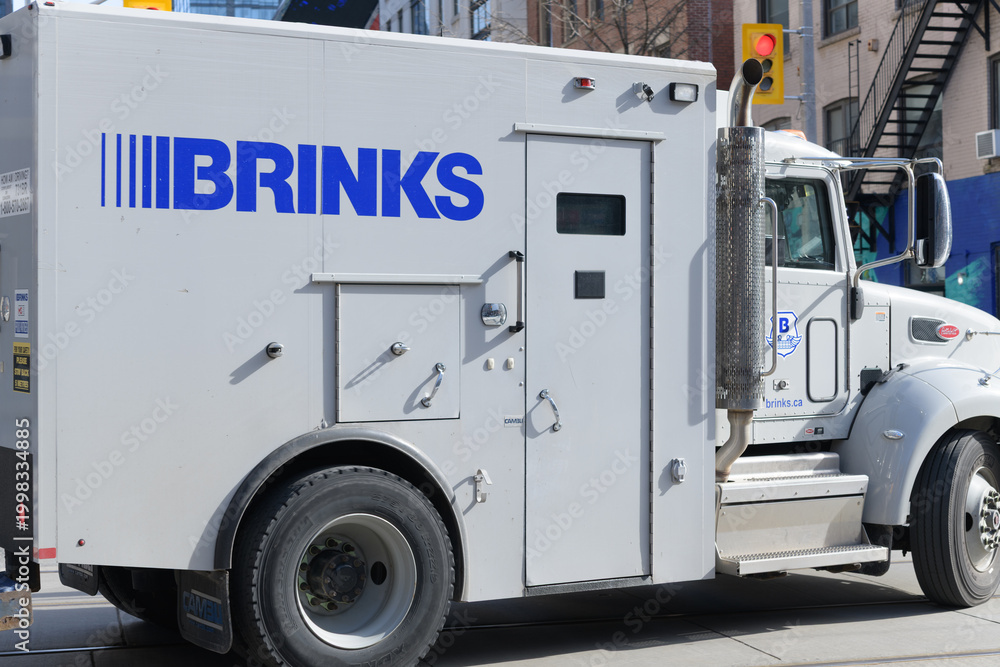 Naklejka premium exterior of a Brinks truck, a heavy-metal armored bubble that moves from A to B in Toronto
