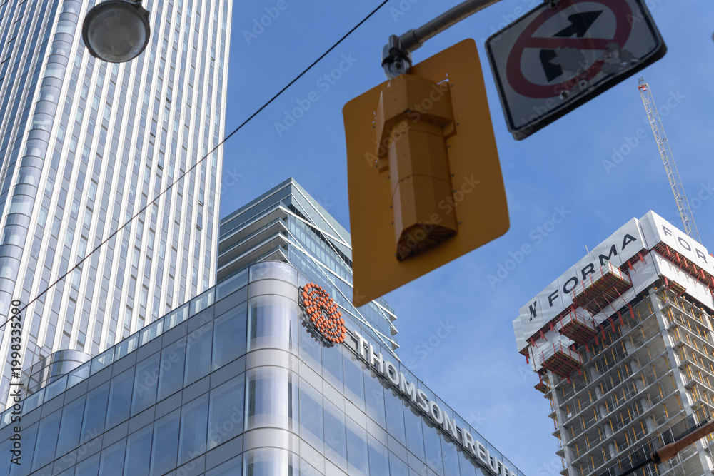 Obraz premium exterior of 19 Duncan, designed by Hariri Pontarini Architects, a mixed-use integration of the heritage Southam Press Building and a modern 58-storey tower, housing Thomson Reuters offices