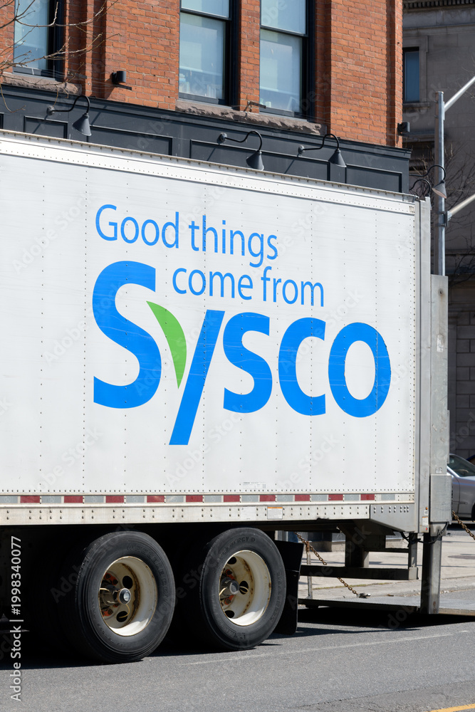 Fototapeta premium exterior logo sign on side of delivery truck of Sysco Corporation, a major U.S. foodservice distributor, in Toronto