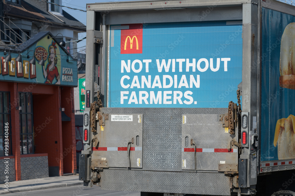 Fototapeta premium McDonald's Canada delivery truck with logo and slogan (not without Canadian farmers) on Dupont St, Toronto