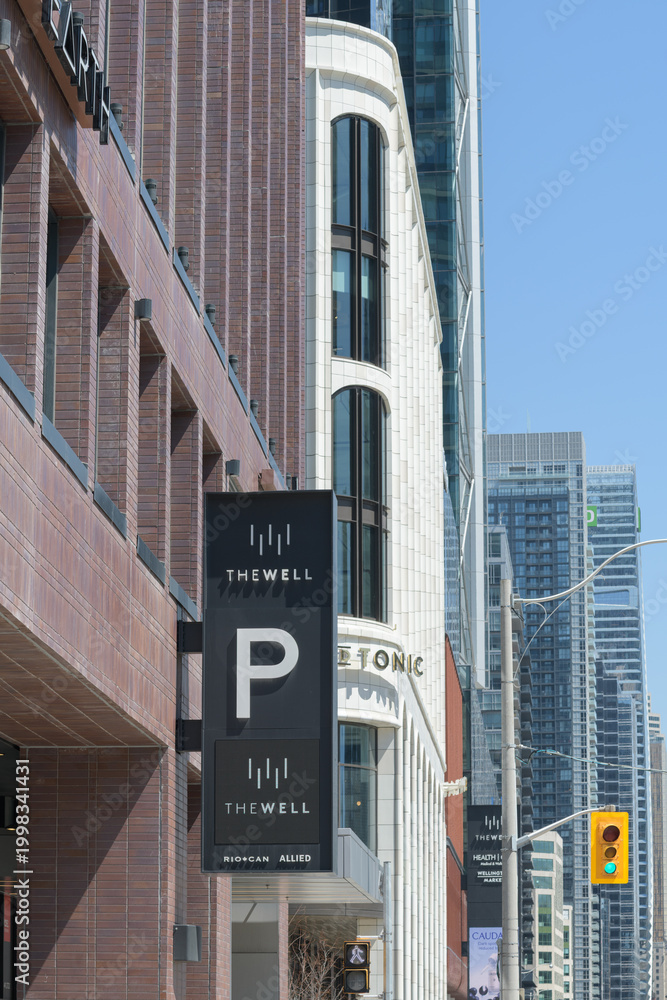 Fototapeta premium exterior building detail of The Well, a mixed use complex at 486 Front St W, Toronto - parking entrance