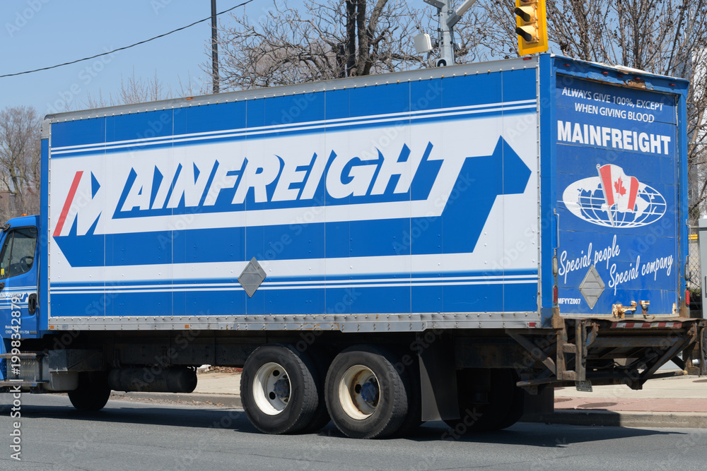 Fototapeta premium view of Mainfreight, an international logistics and freight forwarding company, truck in Toronto