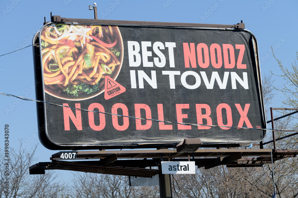Obraz premium roadside billboard with advertising for Noodlebox, a fast food restaurant that specializes in Southeast Asian-style street food, Toronto