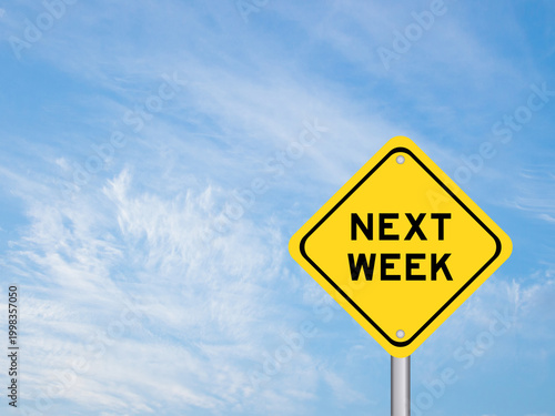 Yellow transportation sign with word next week on blue color sky background
