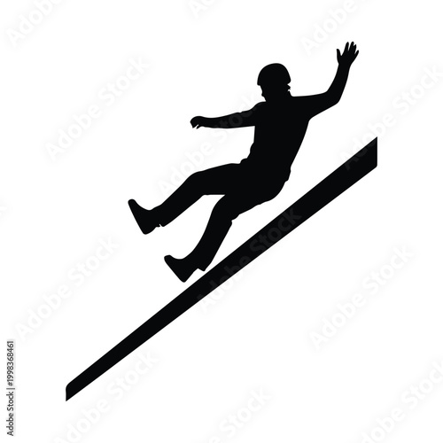 Silhouette of a person sliding down a steep mountain slope