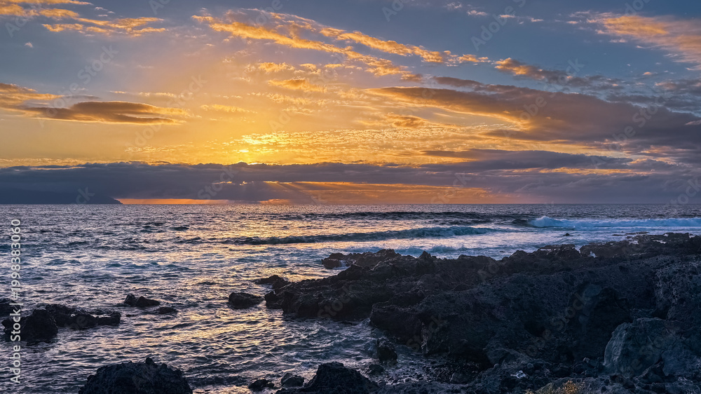 Fototapeta premium Golden hour light over rocky ocean coast in tropical island Tenerife Spain