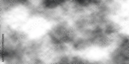 Black and white halftone pattern radiates outward from center