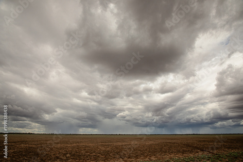 Distant storms on a cloudy day, in a dry landscape