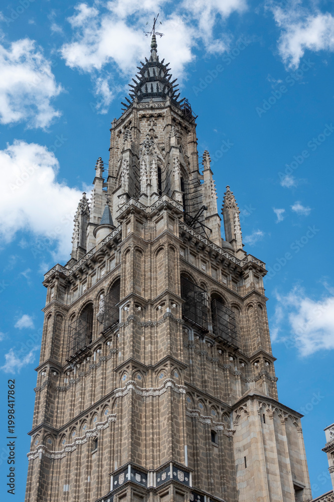 Fototapeta premium Bell tower of the Cathedral of Saint Mary, also known as the Primate Cathedral of Spain, is a Gothic Catholic church in Toledo, Castile-La Mancha, Spain.