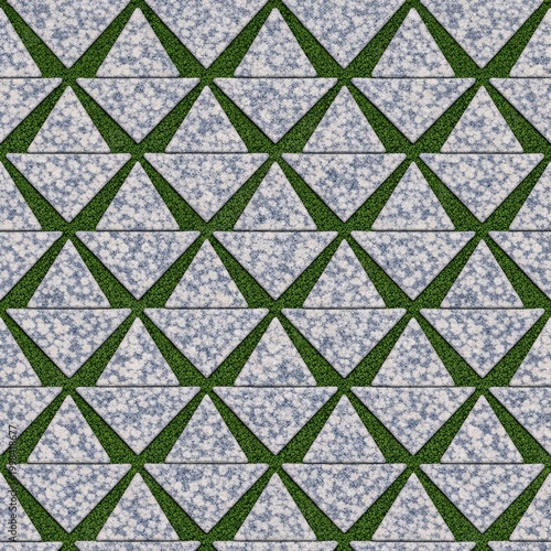 A detailed close-up of a garden pathway featuring a triangular geometric design with white stones and lush green grass accents.