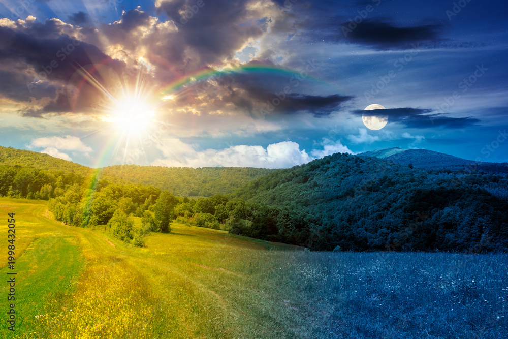 Fototapeta premium day meet night in beautiful countryside. epic view landscape in mountains on summer solstice. sun and moon in harmony over trail through the grassy field near forested rolling hills. rural scenery