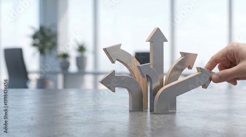 Hand Choosing Direction with Arrows on Table.