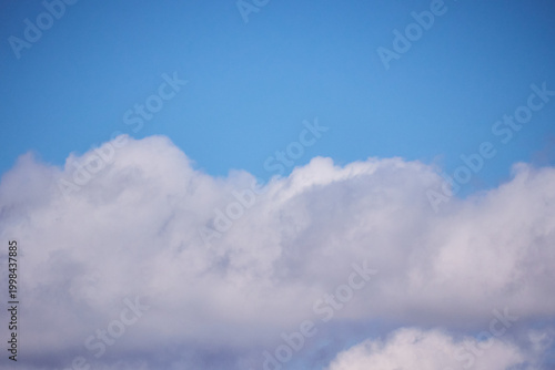 Tableau sur toile Minimalist nature background: one cumulus cloud and blue firmament