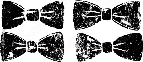 Four vintage black bow ties with distressed texture arranged