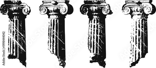 Four vintage classical corinthian columns with ornate capitals and fluted shafts in black and white