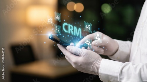Person interacting with crm software on smartphone in modern office setting with glowing interface