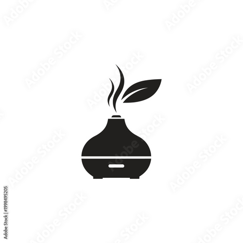 Elegant aromatherapy diffuser with leaf, creating a serene atmosphere for relaxation and wellness.
