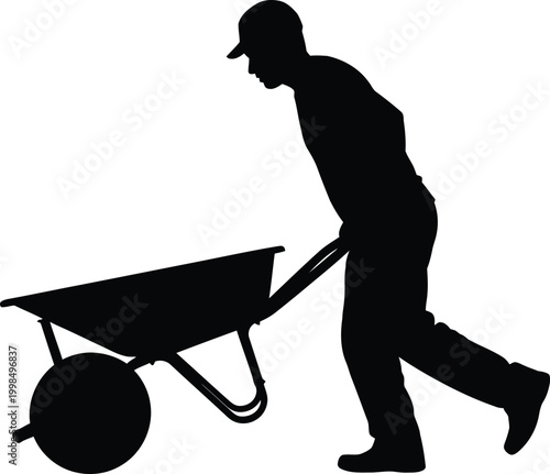 Silhouette of a man pushing a wheelbarrow
