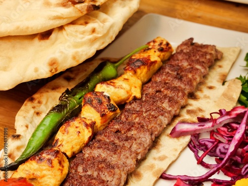 Tableau sur toile A vibrant close-up of an authentic Middle Eastern mixed grill platter
