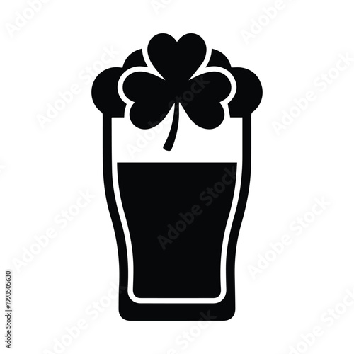 Foamy glass of irish beer with shamrock leaf icon for saint patricks day party celebration