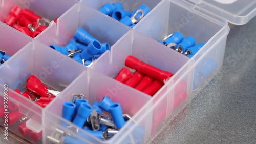Metal tips with a plastic base for mounting on stranded copper wires. Close-up. Soft focus. Macro.