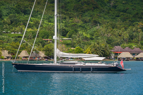 Konstfotografi Beautiful sailing superyacht at anchor in the Cook's Bay in the tropical island