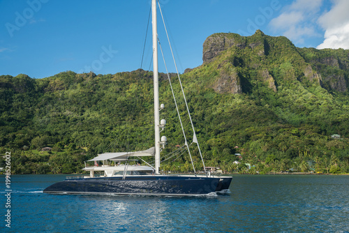 фотографія Beautiful sailing superyacht at anchor in the Cook's Bay in the tropical island
