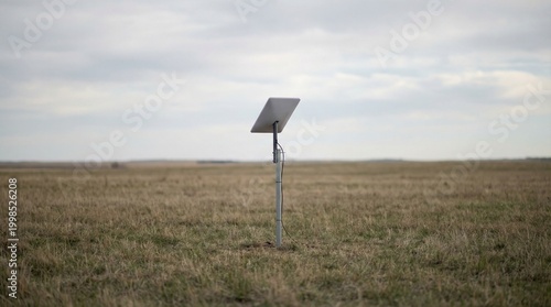 Starlink satellite internet dish antenna installed in a rural field