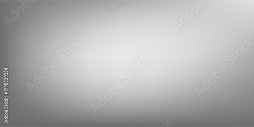 Abstract grey gradient background with a subtle grainy texture, creating a sense of depth and dimension