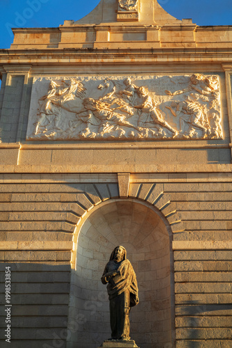 Madrid, Spain -April 04, 2026: The cathedral of Santa María La Real de La Almudena. A statue of the Apostle Paul in a niche of the cathedral.