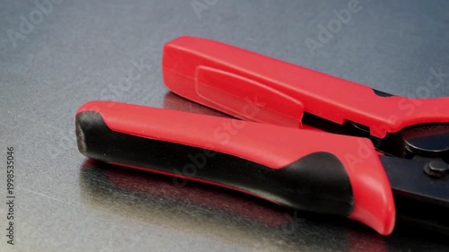 Tool for crimping metal tips on copper mounting wires. 