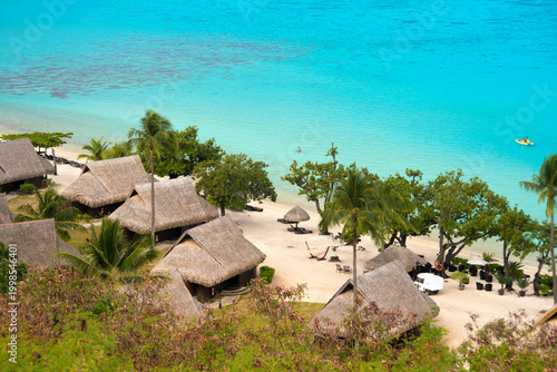 Obraz na płótnie Chalets over the water in French Polynesia island Moorea, resort accomodation in