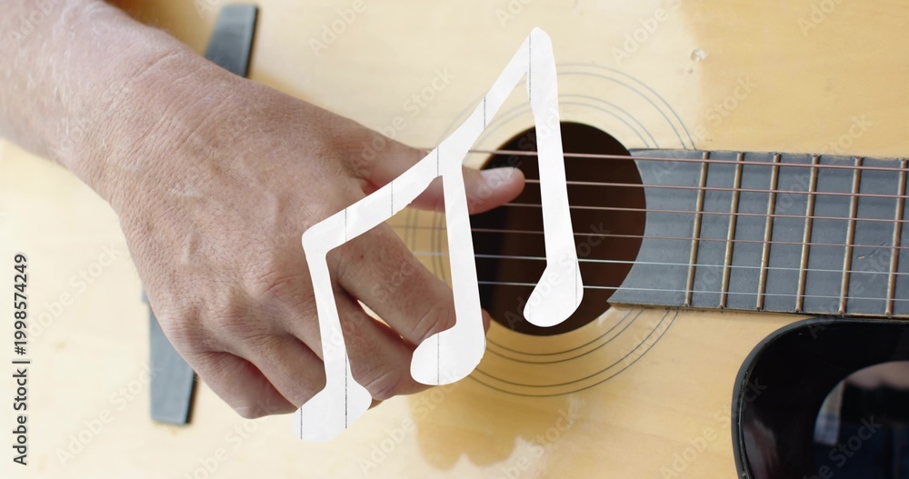 Fototapeta premium Plucking bare forearm and hand over acoustic guitar rosette in studio, with capo and note overlay