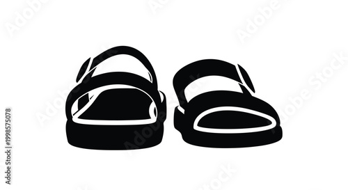 A pair of black sandals are displayed in a stark silhouette