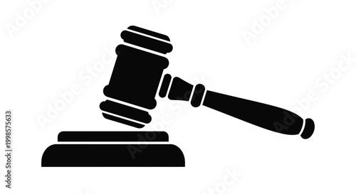 Black gavel resting on a sound block a legal symbol silhouette