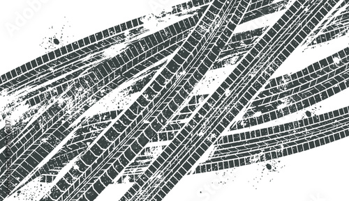 Abstract textured background of car tire tracks and skid marks on a white surface