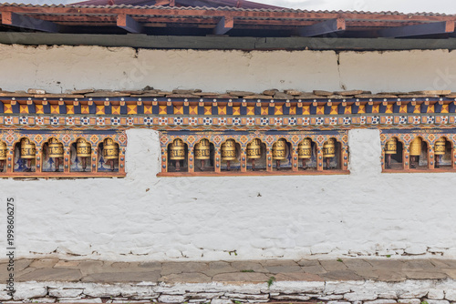 Prayer wheels of Kyichu (Kyerchu) Lhakhang temple near Paro, Bhutan
