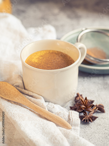 Billede på lærred cup of hot turmeric latte, a moment of self-care and well-being