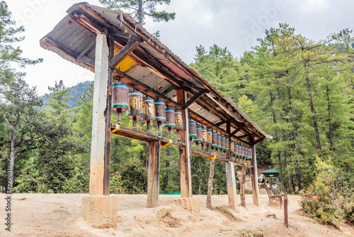 Photos Prayer wheels in a forest near Paro Taktsang (Taktsang Palphug Monastery or the Tiger's Nest), Bhutan