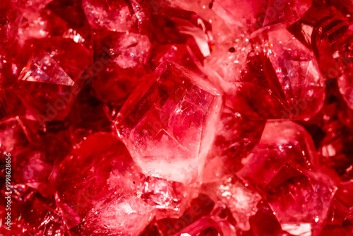 Amethyst red crystals. Gems. Mineral crystals in the natural environment. Texture of precious and semiprecious stones. Seamless background with copy space colored shiny surface of precious stones.