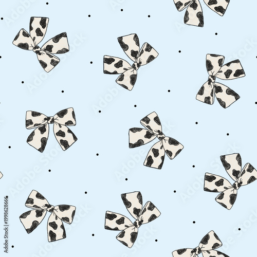Seamless pattern featuring hand drawn cow print bows on a soft blue polka dot background. Perfect for baby products, textiles, packaging, stationery, and modern surface pattern design