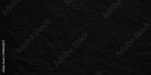 Black slate stone texture background, dark charcoal volcanic rock surface with rough organic grainy paper effect