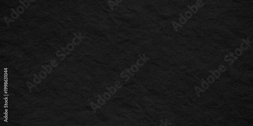 Black slate stone texture background, dark charcoal volcanic rock surface with rough organic grainy paper effect