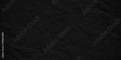 Black slate stone texture background, dark charcoal volcanic rock surface with rough organic grainy paper effect