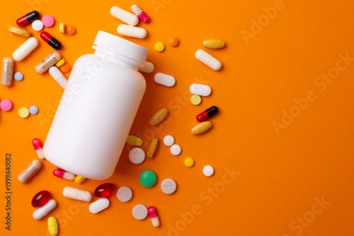 Pills Scattered Widely. Colorful Pills Dispersing Randomly. Various Medications Spilled On White Surface